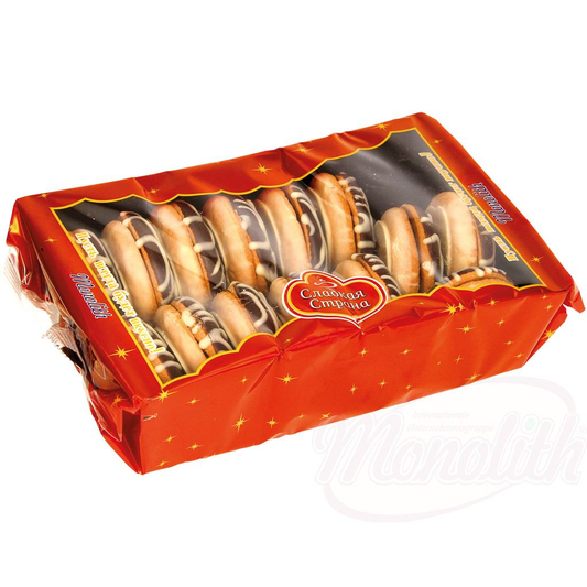 biscuits doubles "Grzybek dekorowany" fourrés aux fruits au goût dabricot, décorés dun glaçage au sucre contenant du lait et dun glaçage gras contenant du cacao